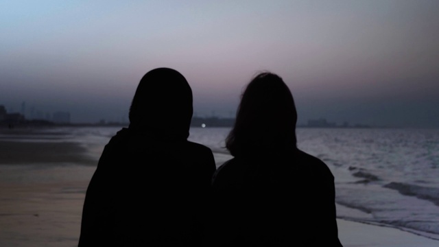 Video Reference: Water, Sky, Gesture, Beach, Atmospheric phenomenon, Body of water, Morning, Horizon, Dusk, Sunrise