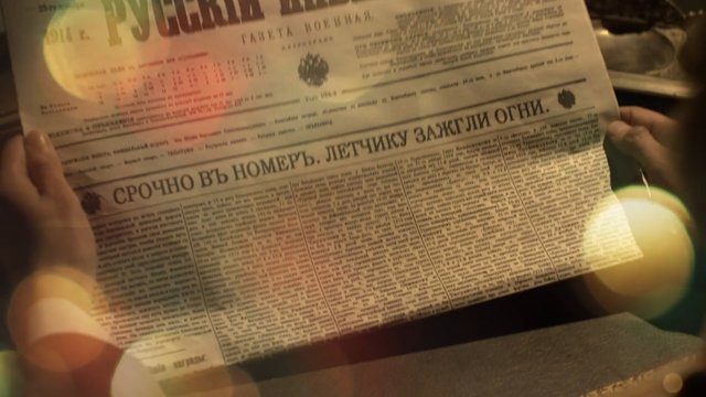 Video Reference: newspaper, cyrillic, reading, hands, old paper, vintage, print, close-up, warm light, indoor, document, text, retro, journalism