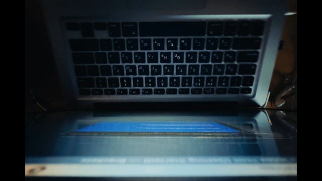 Video Reference: laptop, keyboard, close-up, upside-down, blurry, dark, computer, screen, indoor, technology, device, macro, reflection