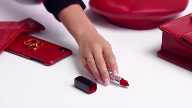 Video Reference: Table, Office supplies, Gesture, Finger, Gadget, Cosmetics, Communication Device, Thumb, Writing instrument accessory, Mobile phone