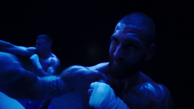 Video Reference: Arm, Blue, Muscle, Human body, Gesture, Flash photography, Performing arts, Entertainment, Elbow, Electric blue