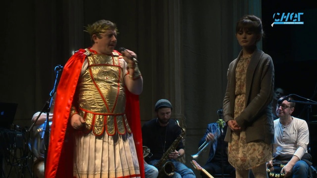 Video Reference: Microphone, Musician, Music, Performing arts, Entertainment, Artist, Fashion design, String instrument, Folk instrument, Performance art