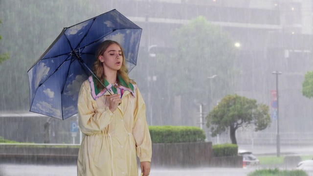 Video Reference: Plant, Sleeve, Standing, Umbrella, Headgear, Travel, Tree, Electric blue, Fashion design, Fashion accessory