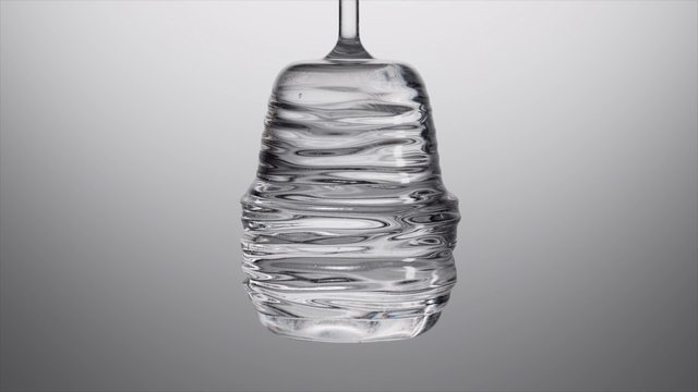 Video Reference: glass, water, close-up, clear, transparent, liquid, container, minimal background, still life, reflection, texture, gray background