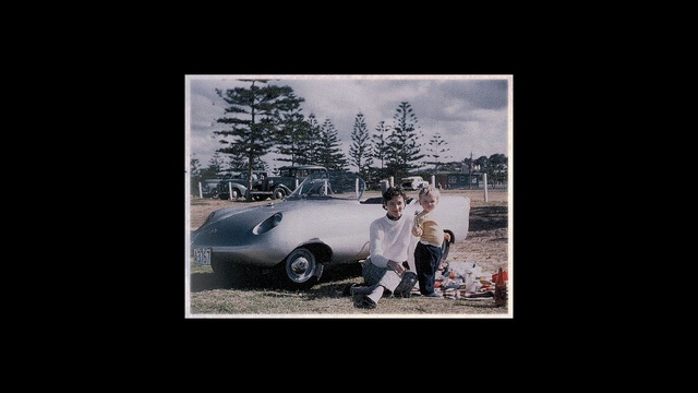 Video Reference: Tire, Wheel, Vehicle, Automotive lighting, Hood, Car, Motor vehicle, Automotive mirror, Flash photography, Sky