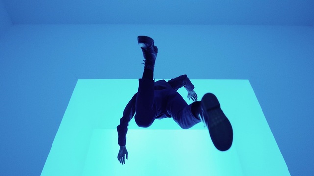 Video Reference: Trousers, Human body, Sneakers, Knee, Electric blue, Entertainment, Recreation, Font, Air sports, Adventure