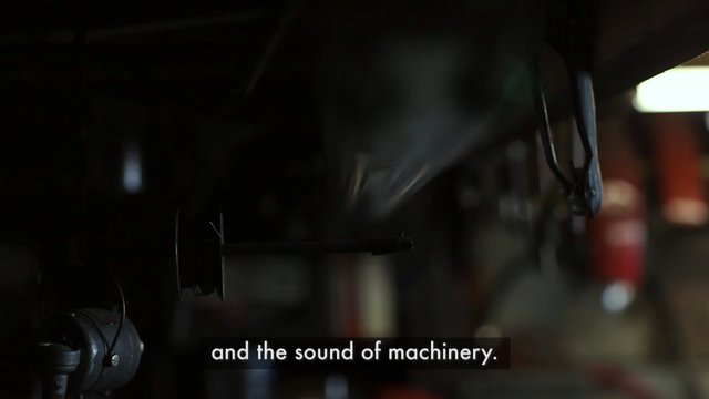 Video Reference: industrial, machinery, equipment, factory, mechanical, dark, close-up, blurred, subtitles, interior, metal, technology