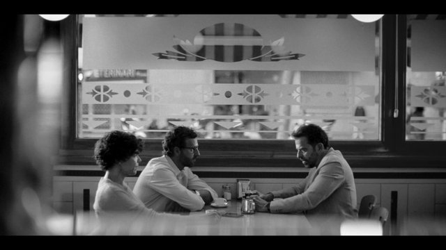 Video Reference: black and white, diner, restaurant, people, conversation, table, indoors, window, cafe, group, seated, meeting, lifestyle, interior