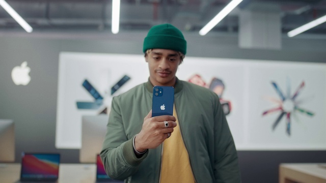 Video Reference: Clothing, Microphone, Outerwear, Cap, Gesture, Audio equipment, Mobile phone, Fun, Electronic device, Event