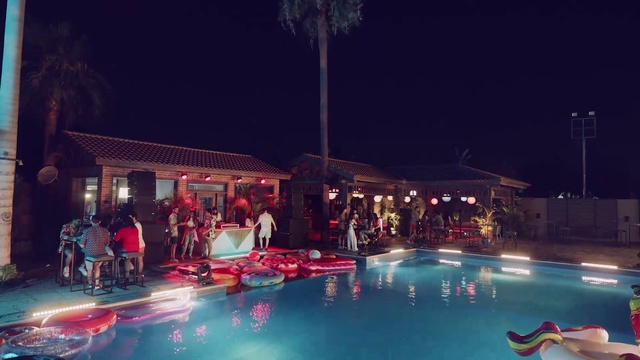 Video Reference: Water, Swimming pool, Building, Leisure, Fun, Tree, Recreation, Event, Resort town, Palm tree