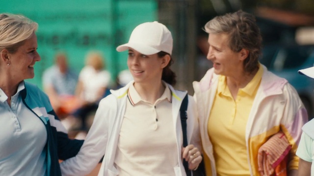 Video Reference: Smile, Facial expression, Vertebrate, Cap, Sleeve, Mammal, Gesture, Baseball cap, Interaction, Street fashion