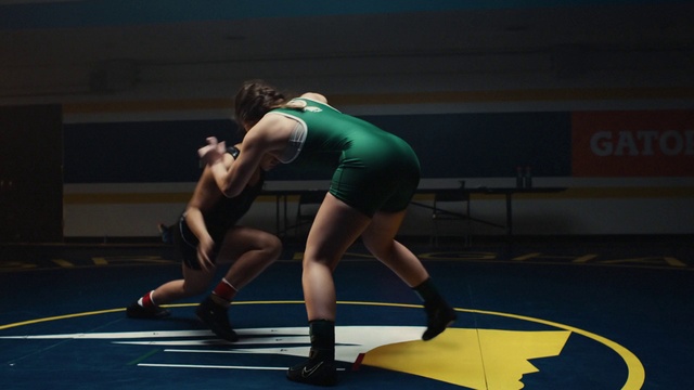 Video Reference: Sports uniform, Wrestling singlet, Knee, Player, Thigh, Leotard, Sportswear, Grappling, Competition event, Wrestling