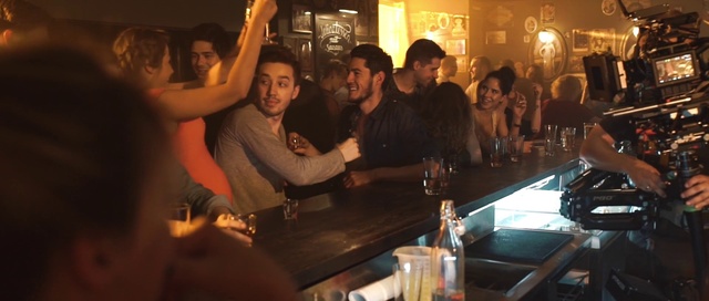 Video Reference: Tableware, Table, Drinking establishment, Smile, Drinkware, Gesture, Drink, Flash photography, Barware, Alcoholic beverage