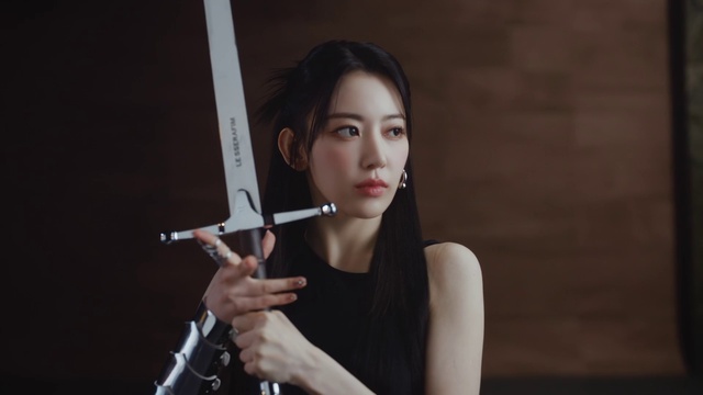 Video Reference: Lip, Eyebrow, Lipstick, Musical instrument, Eyelash, Flash photography, Dress, Gesture, Audio equipment, Musician