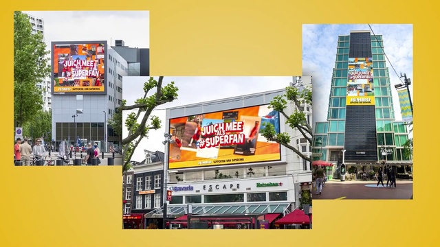 Video Reference: Sky, Building, Yellow, Billboard, Vehicle, Display device, Urban design, Poster, Signage, Font