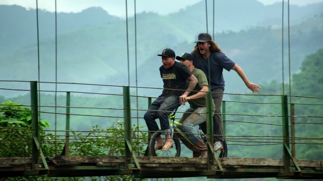 Video Reference: Sky, Plant, Fence, Mountain, Shorts, Leisure, Recreation, Wheel, Blue-collar worker, Electricity