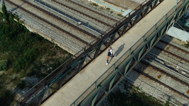 Video Reference: Plant, Grass, Road, Wood, Urban design, Metropolitan area, City, Roof, Track, Handrail