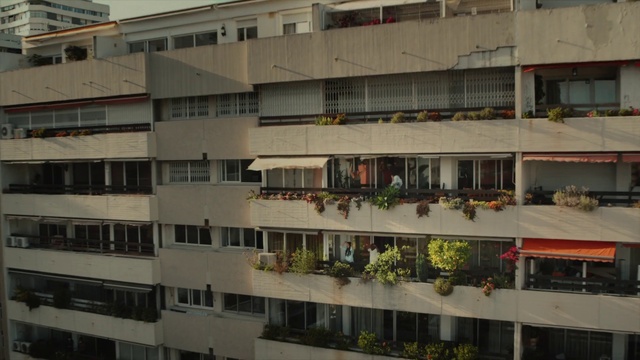 Video Reference: Building, Window, Urban design, Neighbourhood, Facade, City, Condominium, Roof, Commercial building, Mixed-use