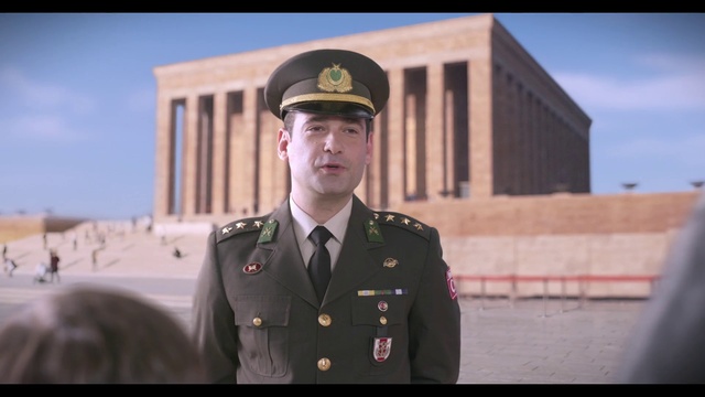 Video Reference: Sky, Military person, Military uniform, Dress shirt, Security, Gesture, Government agency, Collar, Non-commissioned officer, Cap