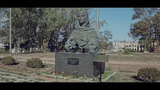 Video Reference: Plant, Statue, Sculpture, Tree, Headstone, Grass, Font, Art, Artifact, Adaptation