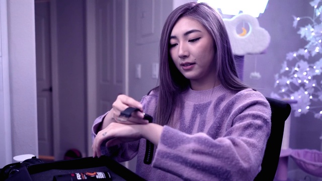 Video Reference: Purple, Eyelash, Flash photography, Violet, Eyewear, Black hair, Audio equipment, Fashion design, Happy, Magenta