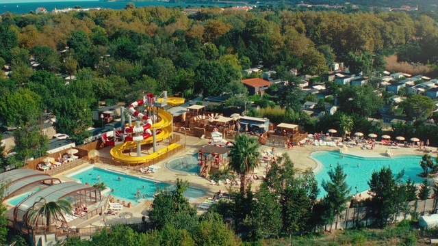 Video Reference: Water, Building, Tree, Swimming pool, Plant, Seaside resort, Leisure, Landscape, Real estate, Resort town