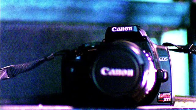 Video Reference: camera, canon, eos, dslr, close-up, electronics, photography, lens, strap, low-light, grainy, product, technology