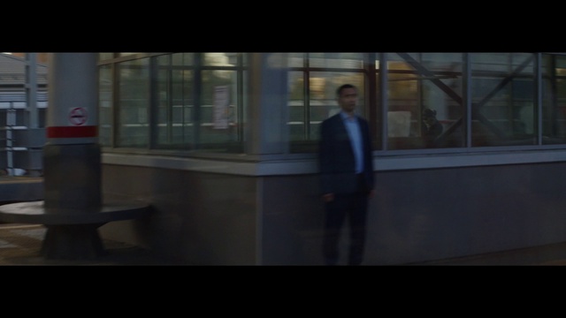 Video Reference: Tints and shades, Window, Glass, Darkness, Transparent material, Formal wear, City, White-collar worker, Sitting, Flooring