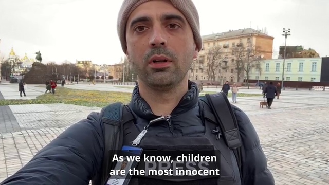 Video Reference: Forehead, Outerwear, Beard, Human, Sleeve, Tree, Sky, Facial hair, Travel, Moustache