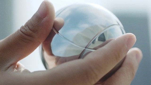 Video Reference: Hand, Finger, Gesture, Thumb, Sky, Soccer ball, Nail, Close-up, Sports equipment, Ball
