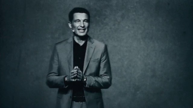 Video Reference: Smile, Flash photography, Sleeve, Coat, Standing, Gesture, Style, Collar, Black-and-white, Suit