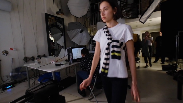 Video Reference: Shoulder, Sleeve, Flash photography, Automotive design, Fashion design, Table, Street fashion, Engineering, Desk, Event