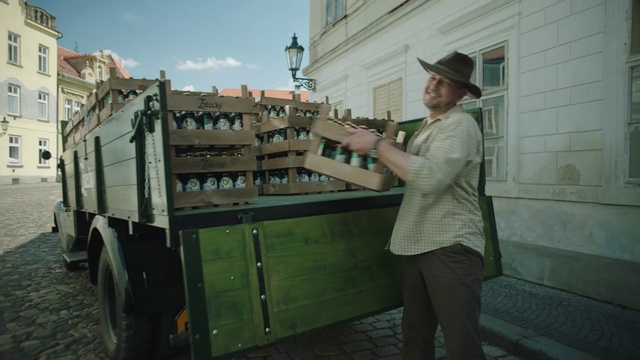 Video Reference: Wheel, Tire, Building, Sky, Cloud, Hat, Travel, Cap, Gas, Window