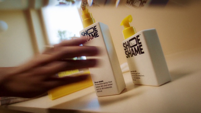 Video Reference: Hand, Fluid, Yellow, Gesture, Finger, Liquid, Publication, Font, Material property, Writing implement