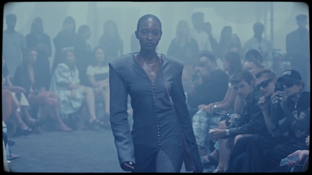 Video Reference: Cloud, World, Flash photography, Sky, Entertainment, Suit, Formal wear, Fashion design, Electric blue, Event