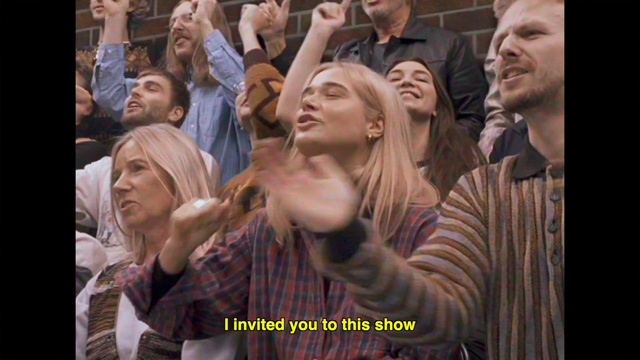 Video Reference: Hand, Arm, Shirt, Smile, Entertainment, Gesture, Fan, T-shirt, People, Event