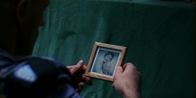 Video Reference: Hand, Picture frame, Wood, Gesture, Finger, Gadget, Font, Wrist, Electric blue, Grass