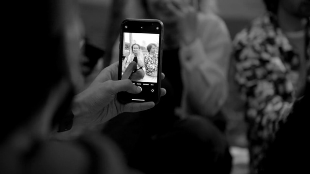 Video Reference: Hand, Photographer, Flash photography, Gesture, Cameras & optics, Gadget, Black-and-white, Communication Device, Nail, Font