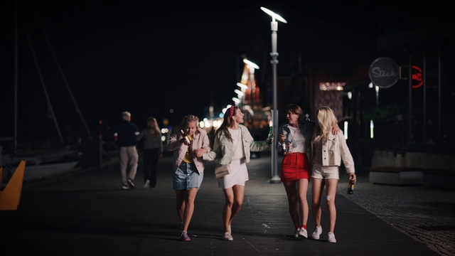 Video Reference: Shorts, Dress, Entertainment, Performing arts, Midnight, Event, City, Darkness, Pedestrian, Human leg