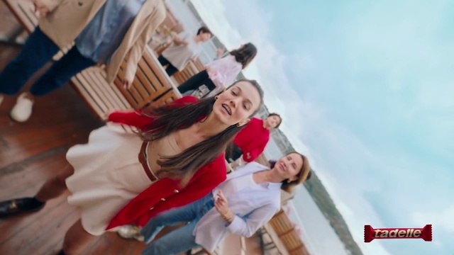 Video Reference: Gesture, Happy, Flash photography, Thigh, Leisure, Sky, Fun, Event, Fashion design, Chair
