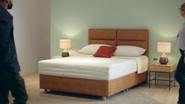 Video Reference: Brown, Furniture, Comfort, Wood, Bed frame, Textile, Shade, Pillow, Interior design, Grey