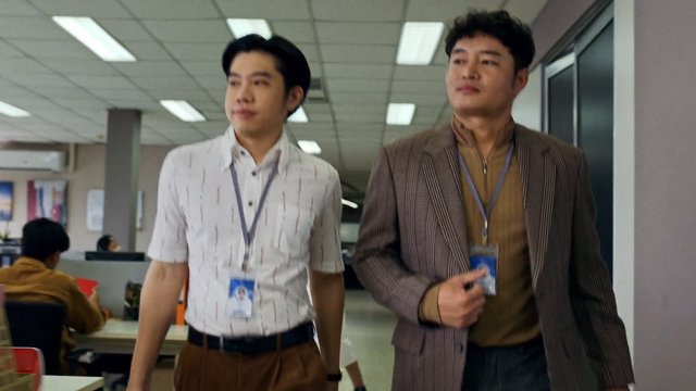 Video Reference: office, hallway, two men, employees, ID badges, walking, indoor, workplace, business, corridor, desk, fluorescent lights