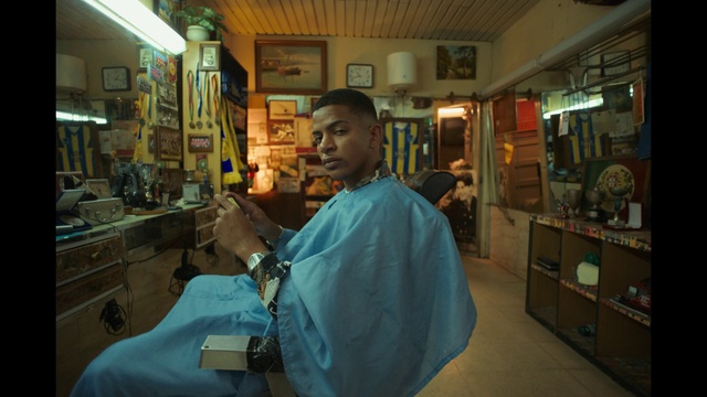 Video Reference: Beauty salon, Barber, Picture frame, Barber chair, Mirror, Service, T-shirt, Event, Personal grooming, Room