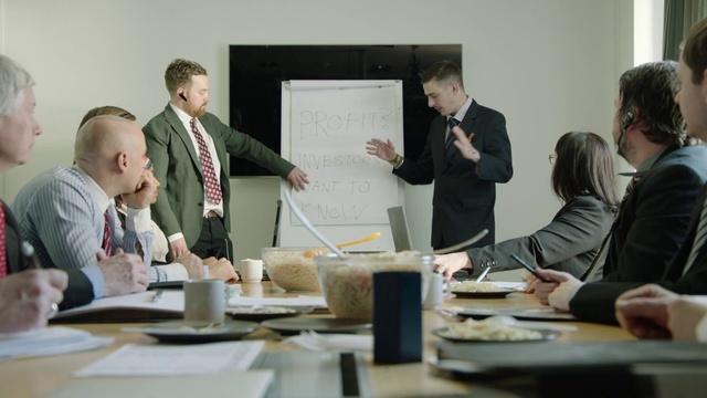 Video Reference: Table, Coat, Gesture, Whiteboard, Tableware, White-collar worker, Event, Suit, Handwriting, Job