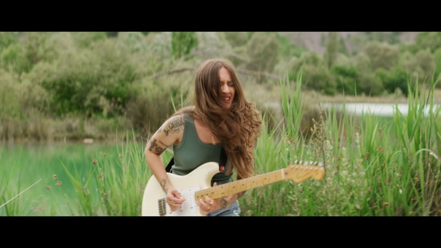 Video Reference: Plant, Musical instrument, Guitar, People in nature, Flash photography, Happy, Natural landscape, Wood, Grass, Fawn