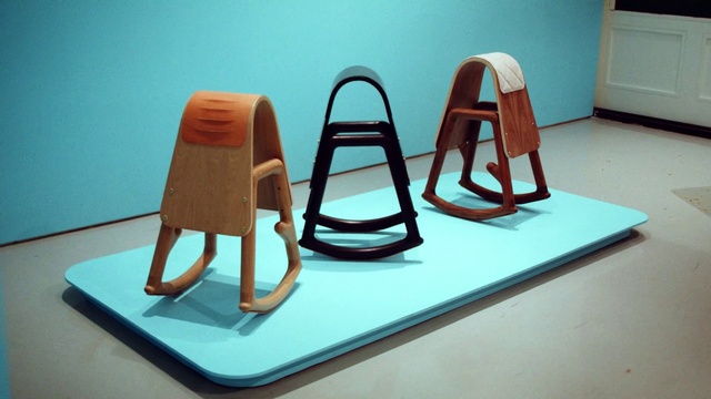 Video Reference: Wood, Chair, Electric blue, Art, Balance, Visual arts, Room, Triangle, Event, Flooring