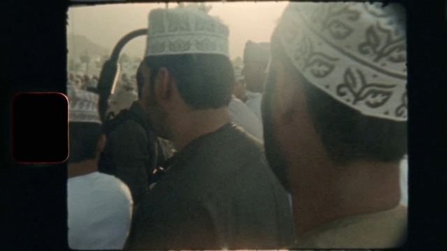 Video Reference: Cap, Hat, Eyewear, Headgear, Baseball cap, T-shirt, Font, Electronic device, Sun hat, Display device