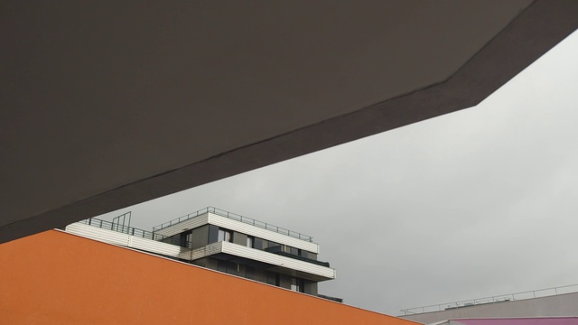 Video Reference: Sky, Building, Rectangle, Fixture, Window, Material property, Composite material, Tints and shades, Urban design, Facade