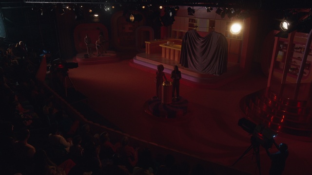 Video Reference: Musical instrument accessory, Chair, Entertainment, Performing arts, Music venue, Event, Performing arts center, Performance art, Curtain, Music