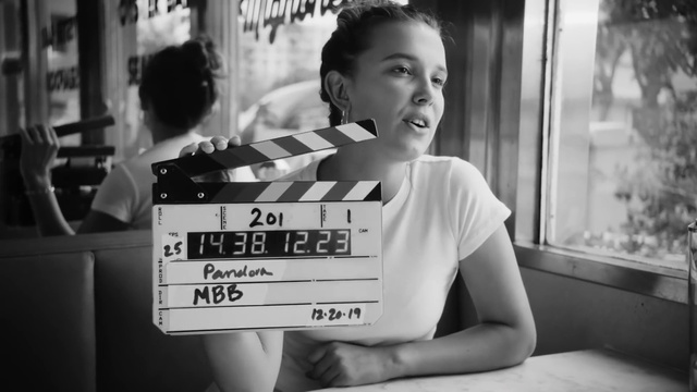 Video Reference: Facial expression, White, Black, Black-and-white, Standing, Style, Window, Font, Monochrome, Happy